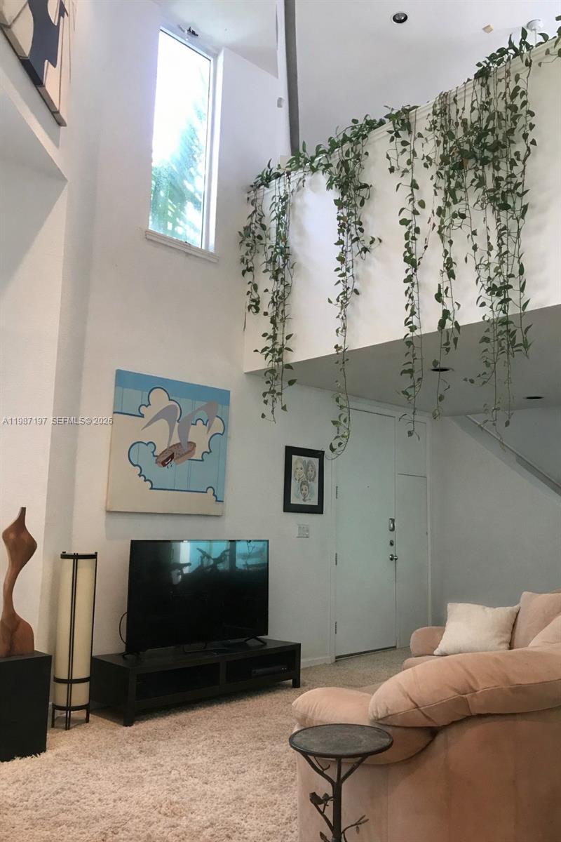 3151 Freeman Street Miami, FL 33133 - Photo 9 of 20 a living room with furniture and a fireplace