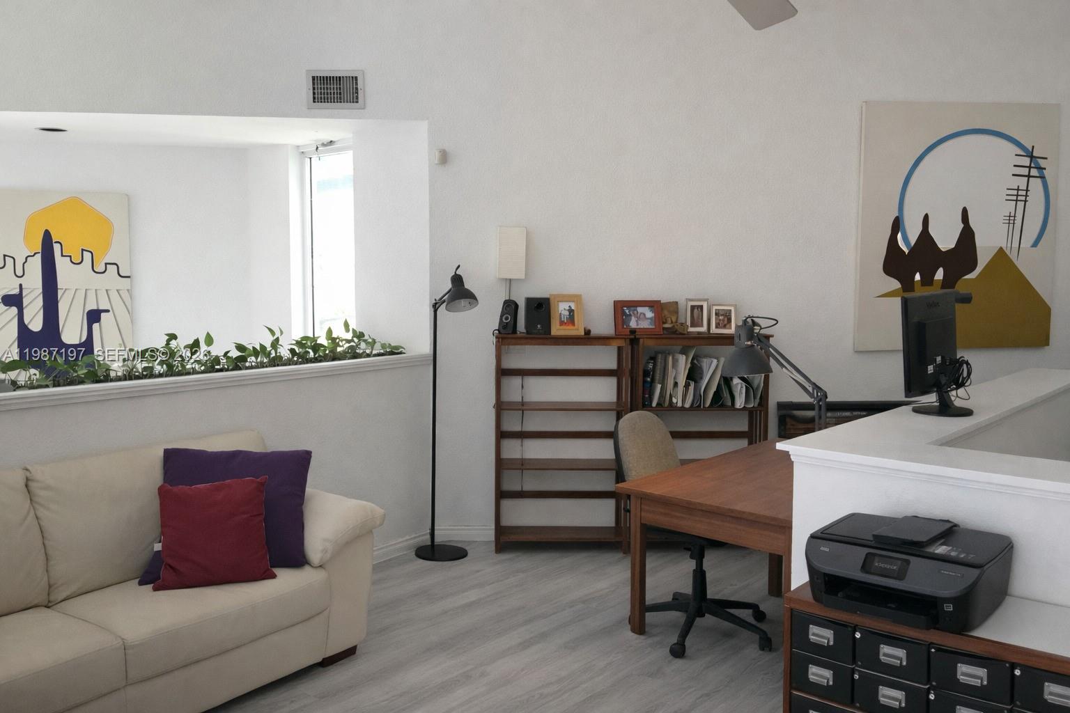 3151 Freeman Street Miami, FL 33133 - Photo 10 of 20 a living room with furniture and wooden floor