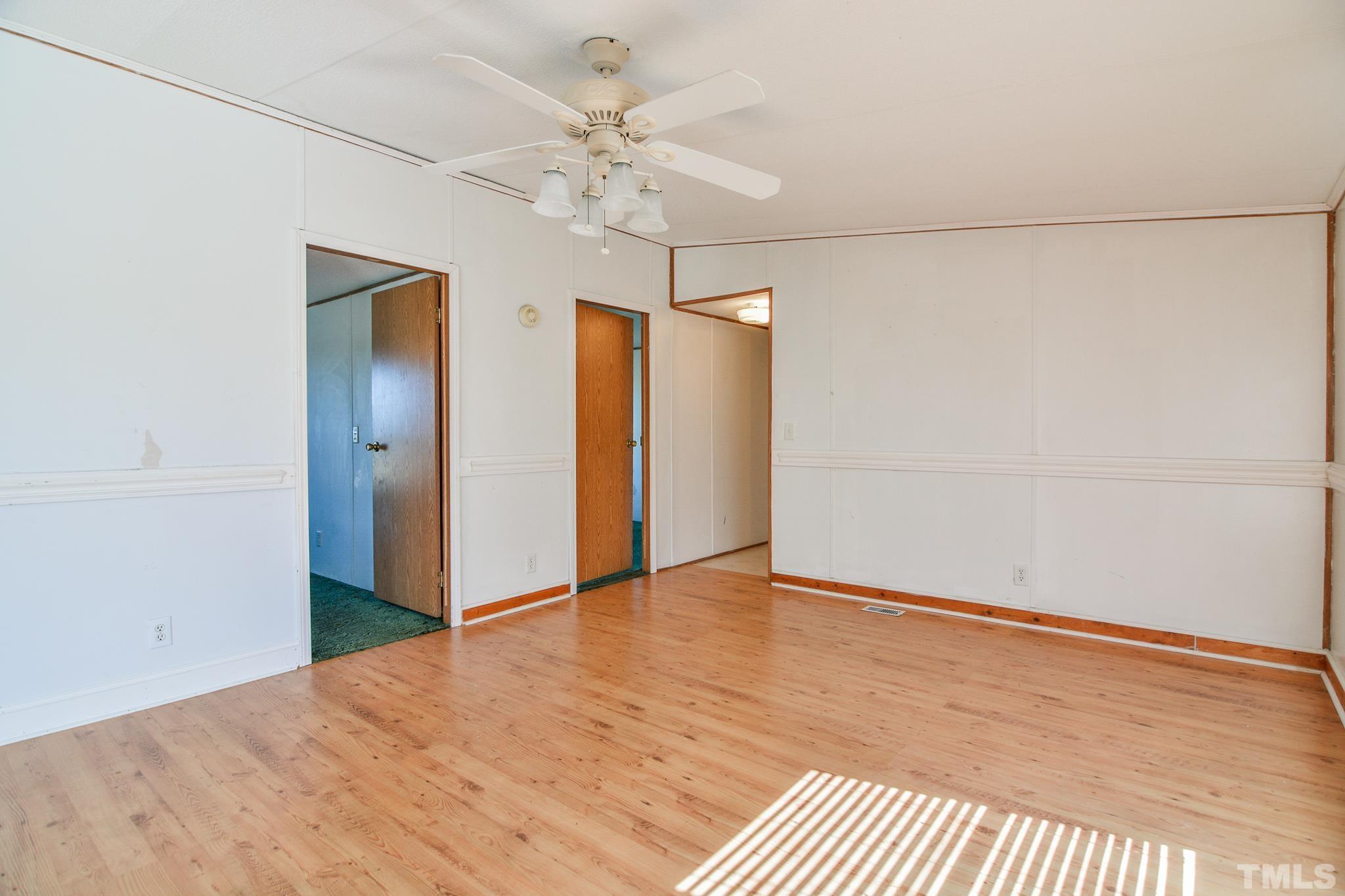 141 Wilson Road Lucama, NC 27851 - Photo 15 of 23 a view of an empty room with a chandelier fan