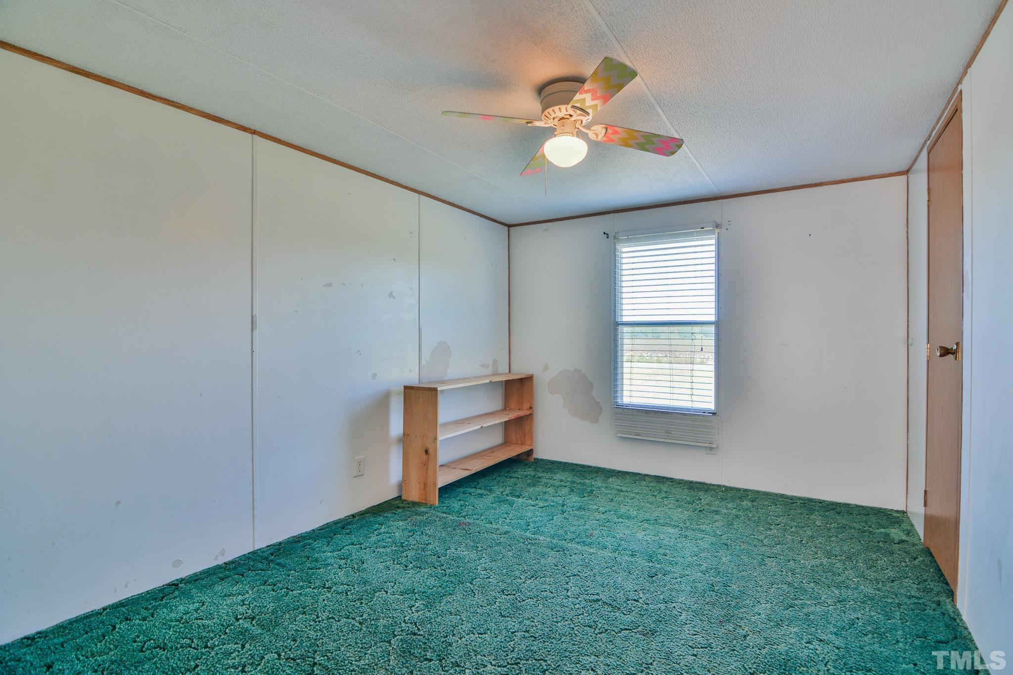 141 Wilson Road Lucama, NC 27851 - Photo 20 of 23 an empty room with windows