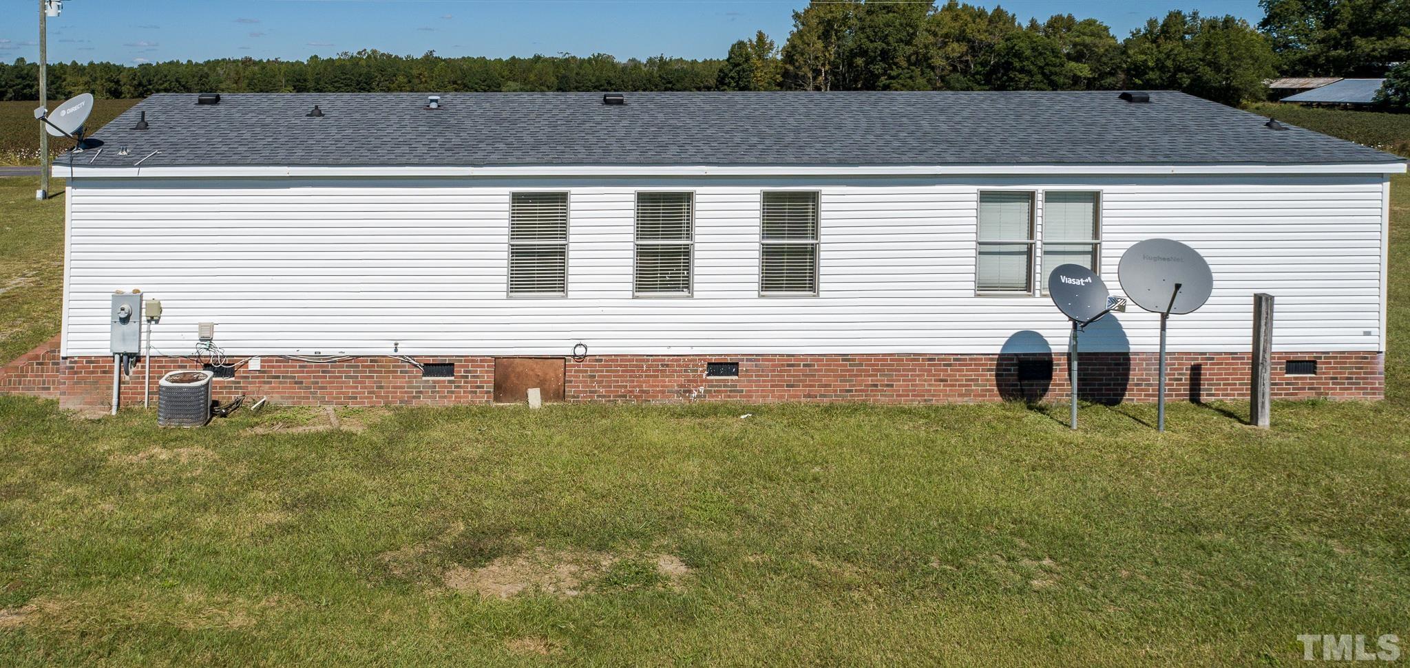 141 Wilson Road Lucama, NC 27851 - Photo 5 of 23 a front view of a house with a yard
