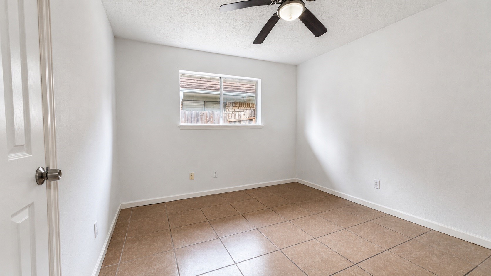 4418 Ponca Street Pasadena, TX 77504 - Photo 17 of 23 Light-filled bedroom with a practical shape and clean wall space. (image has been enhance for marketing purposes)