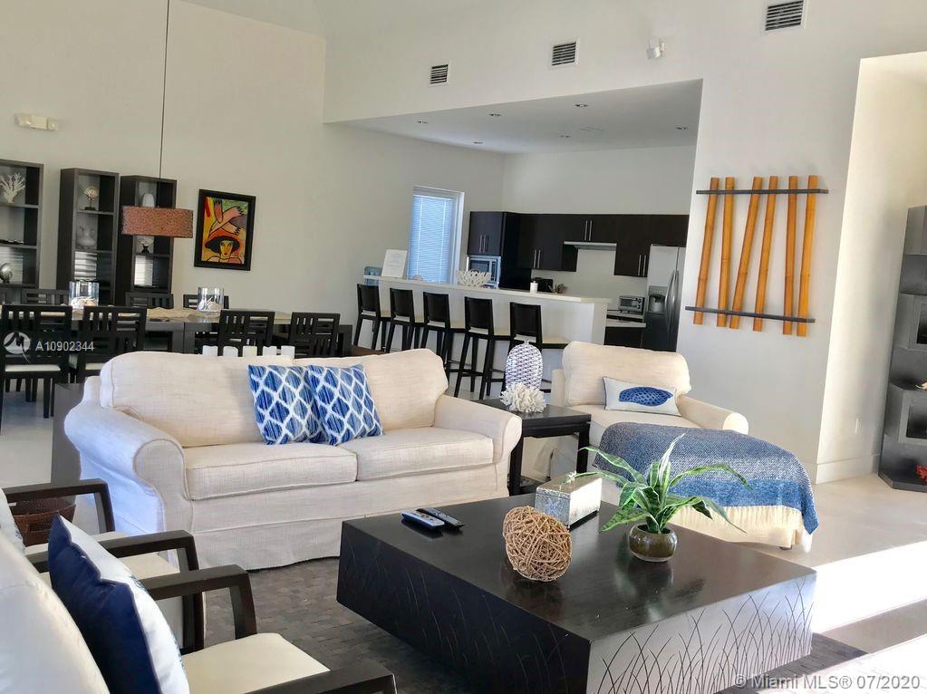 6900 Bimini Bahamas undefined, BH 0000 - Photo 2 of 17 a living room with furniture and wooden floor