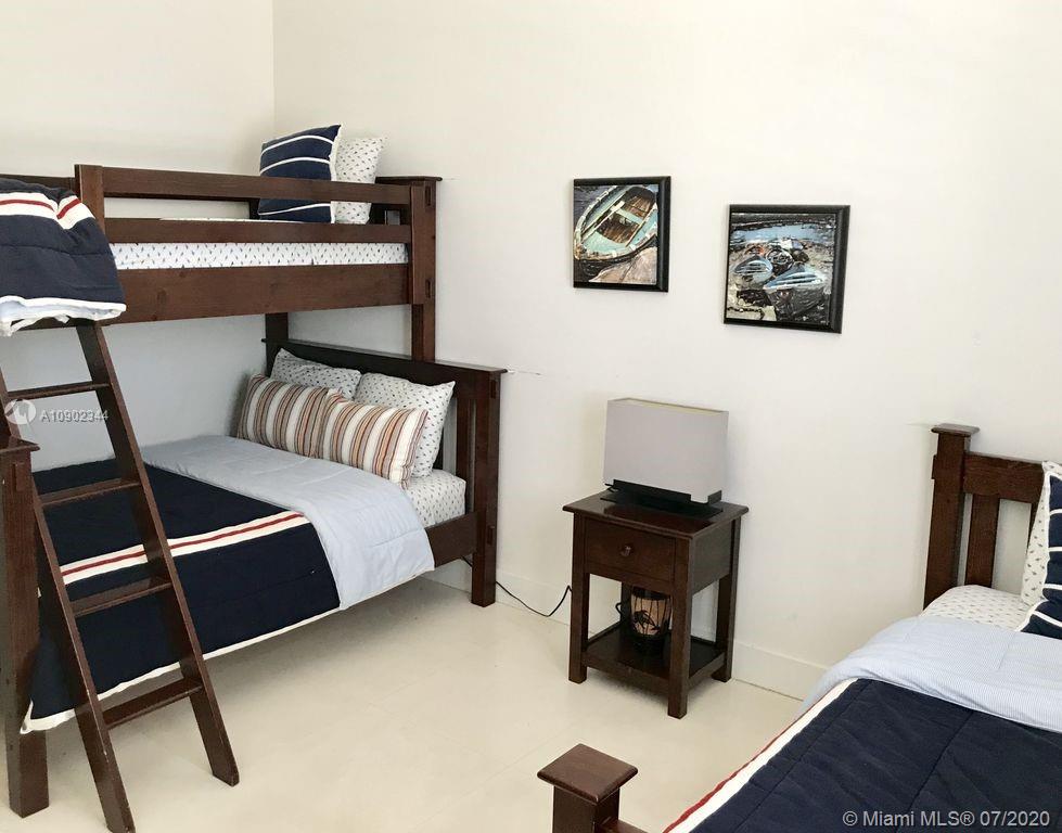 6900 Bimini Bahamas undefined, BH 0000 - Photo 8 of 17 a bedroom with a bed and a desk