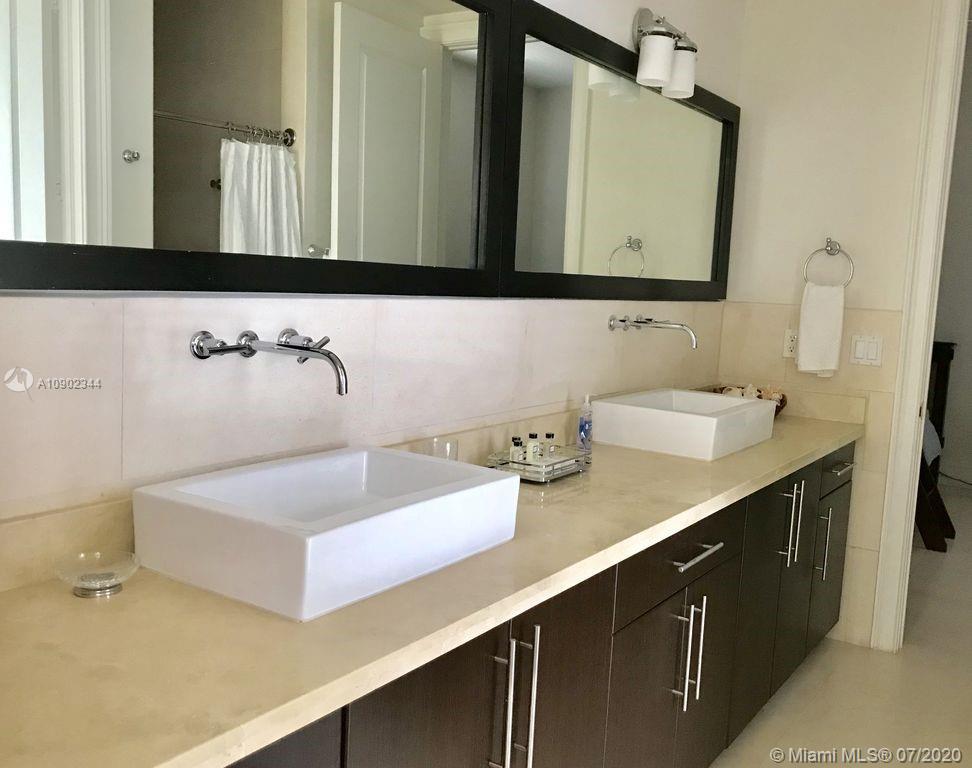 6900 Bimini Bahamas undefined, BH 0000 - Photo 10 of 17 a bathroom with a sink and a mirror