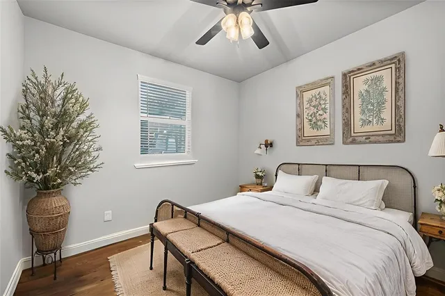 a bedroom with a bed and a chair