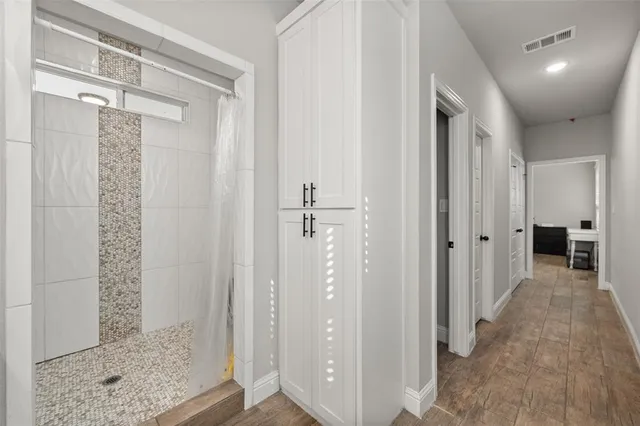 a view of a bathroom from a hallway