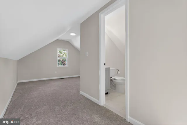 a view of an empty room with a bathroom
