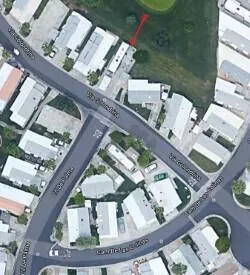 a picture of white wall with a white comforter