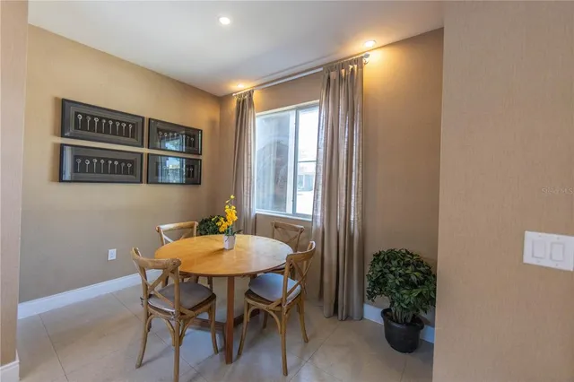 a dining room with furniture and window