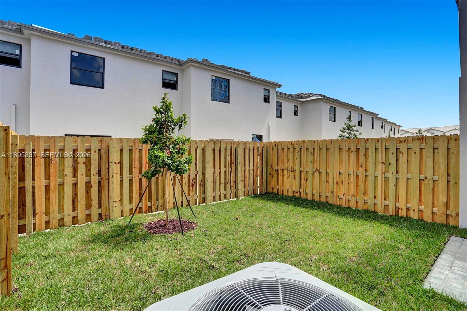 13375 Southwest 287th Street Homestead, FL 33033 - Photo 22 of 44 a front view of a house with garden