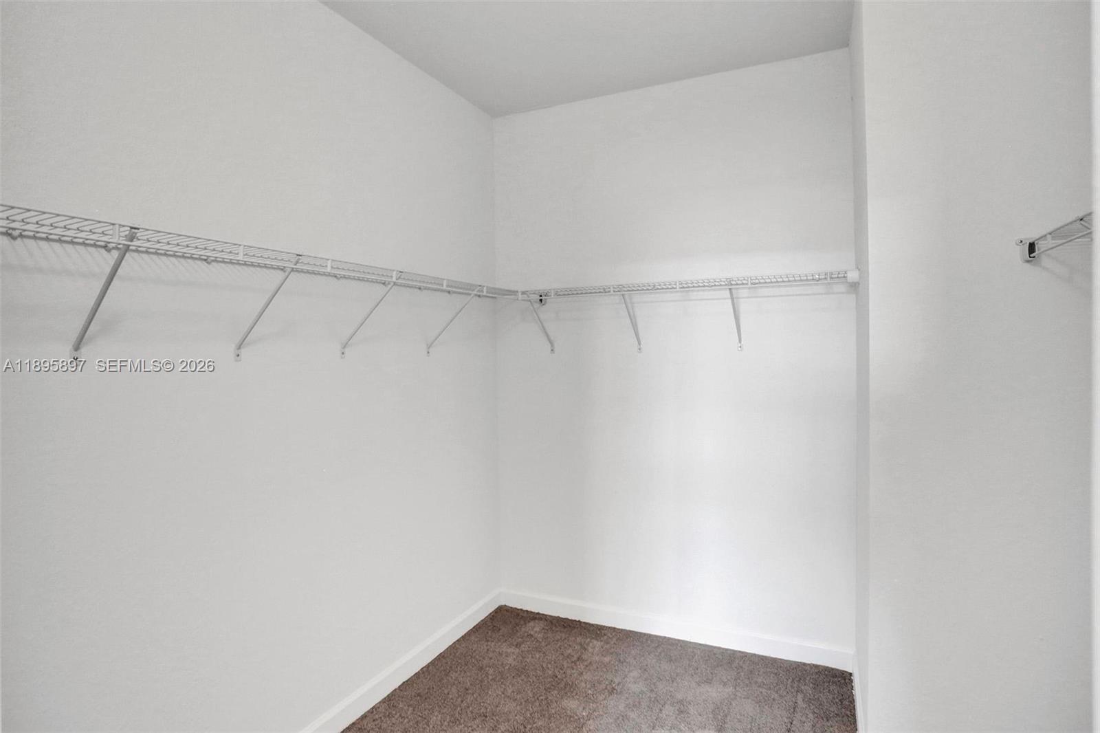 13375 Southwest 287th Street Homestead, FL 33033 - Photo 27 of 44 a view of a room with racks on the wall