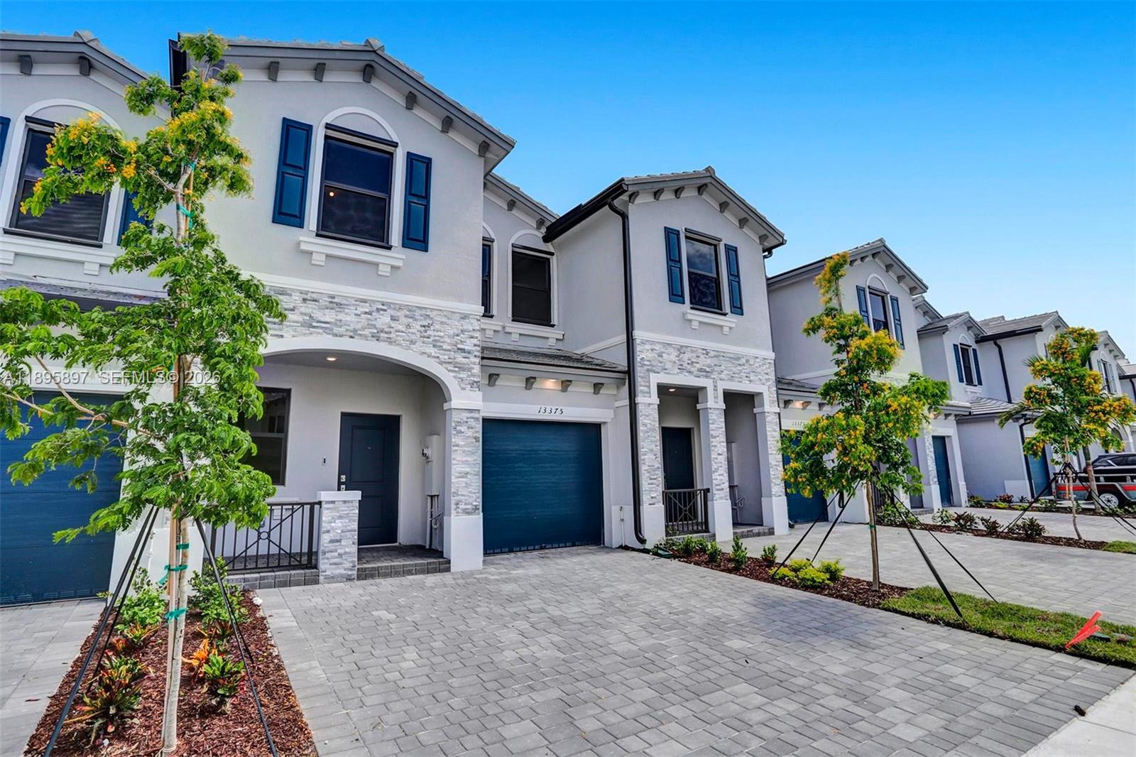 13375 Southwest 287th Street Homestead, FL 33033 - Photo 4 of 44 a front view of a house with yard