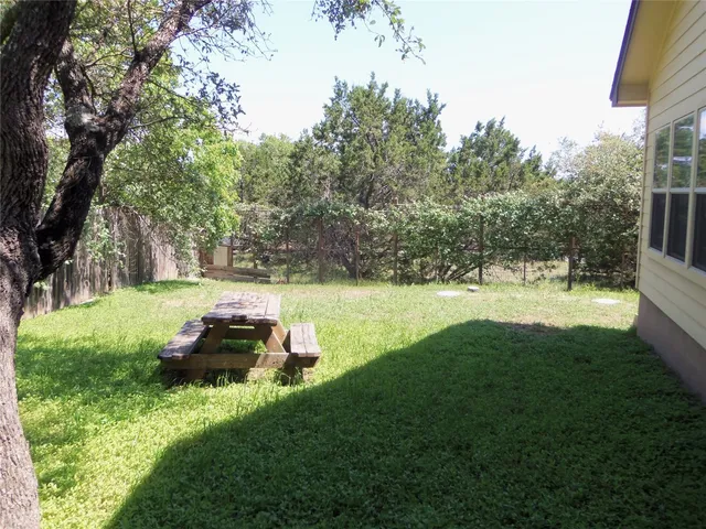 a backyard of a house with lots of green space