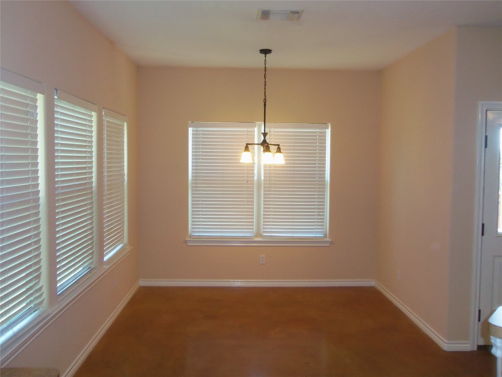 10611 Lake Beach Drive Dripping Springs, TX 78620 - Photo 6 of 22 a view of an empty room with a window