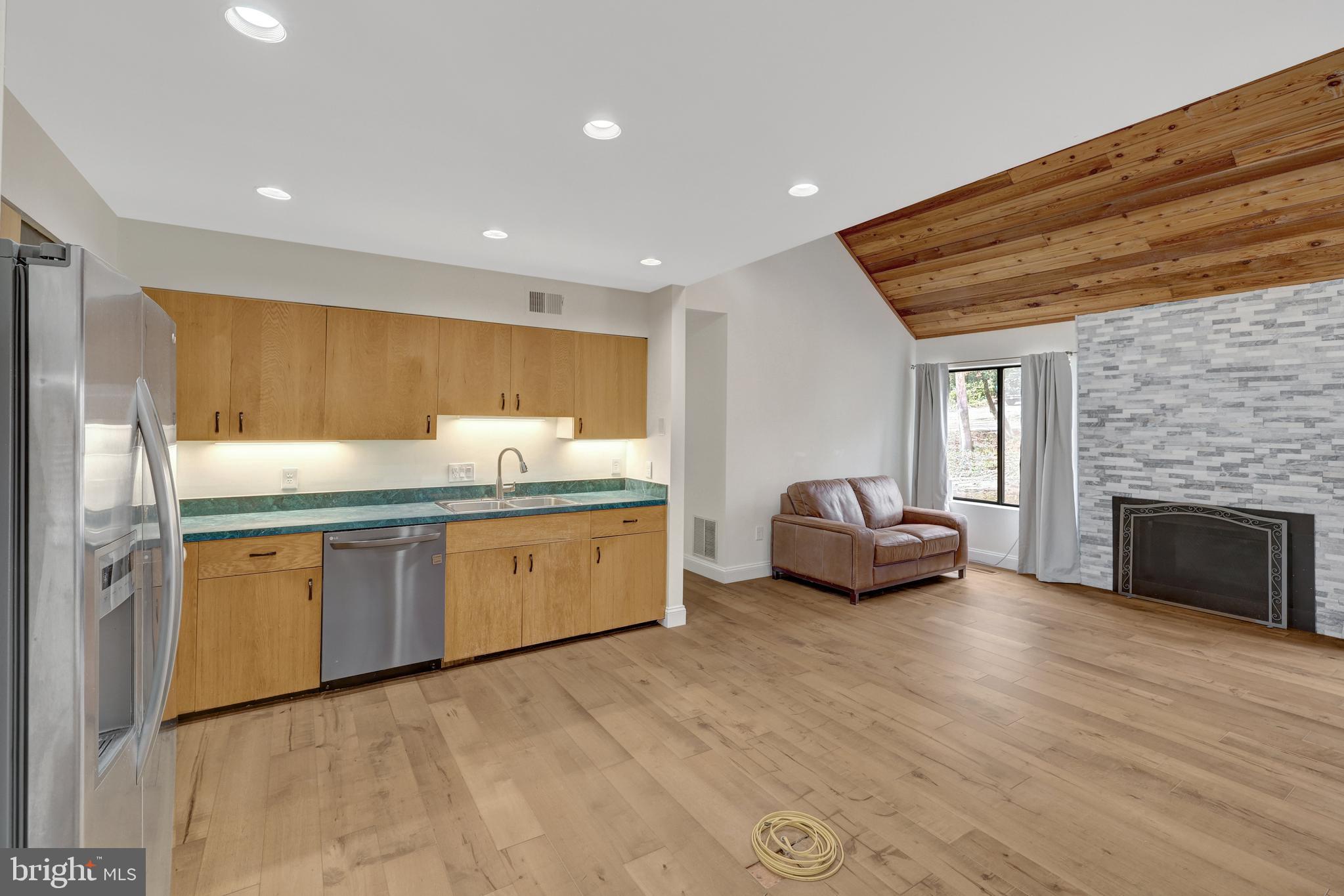 1941 Upper Lake Drive Reston, VA 20191 - Photo 14 of 51 a kitchen with sink refrigerator and microwave