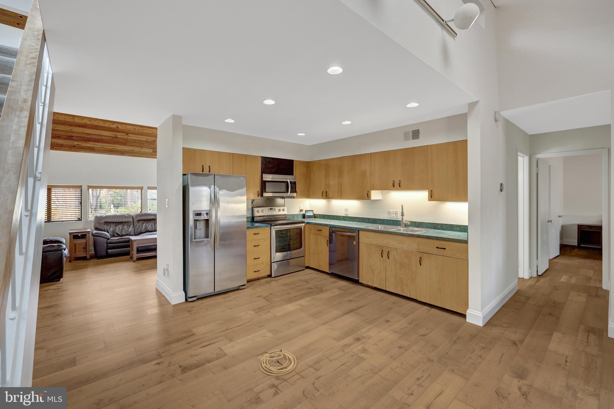 1941 Upper Lake Drive Reston, VA 20191 - Photo 16 of 51 a kitchen with refrigerator and cabinets