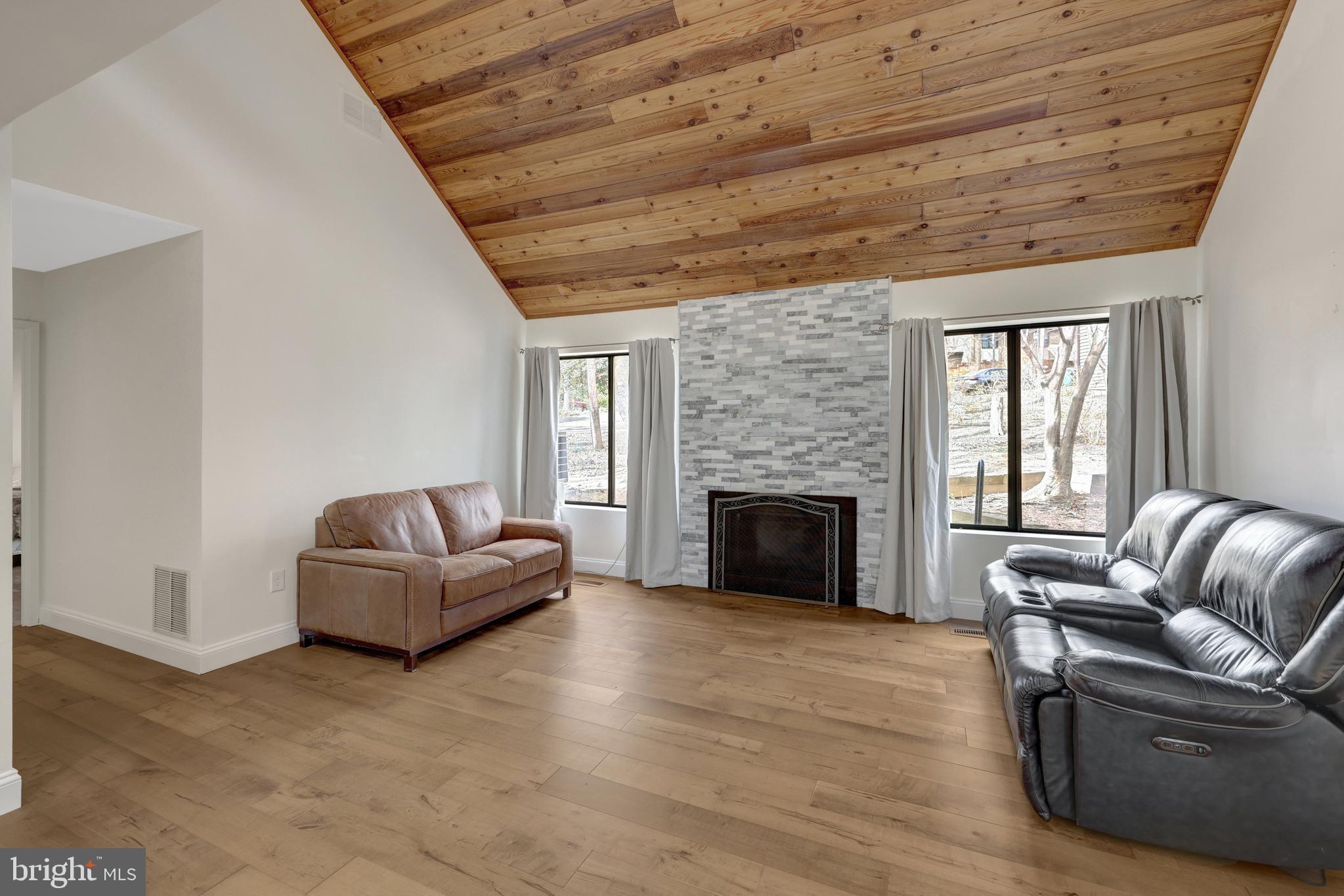 1941 Upper Lake Drive Reston, VA 20191 - Photo 19 of 51 a living room with furniture and a fireplace