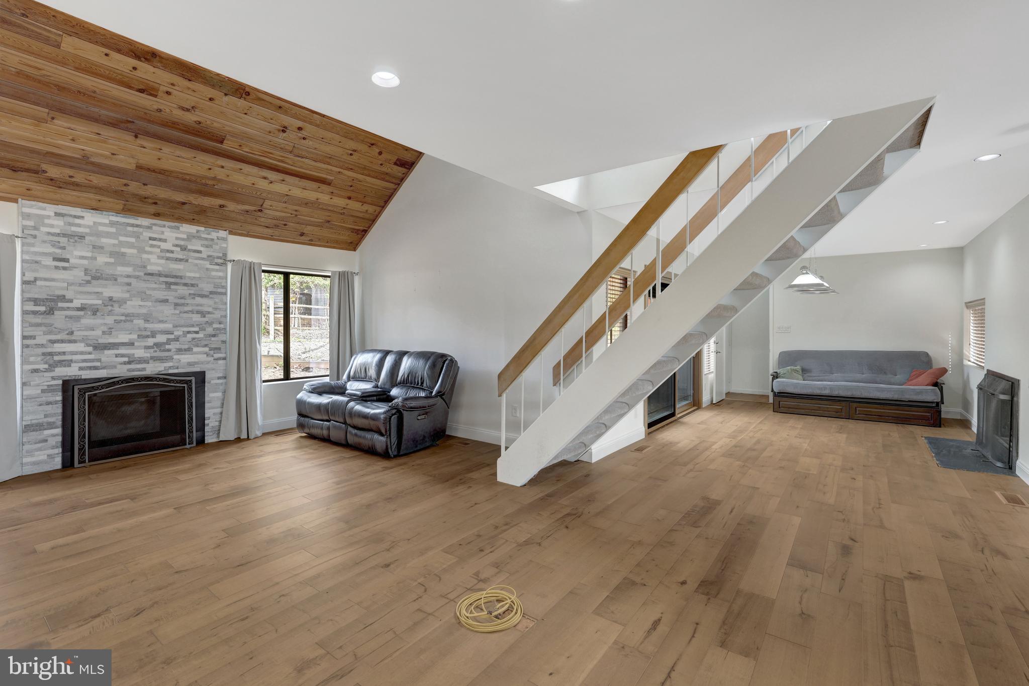 1941 Upper Lake Drive Reston, VA 20191 - Photo 20 of 51 a living room with furniture and a fireplace