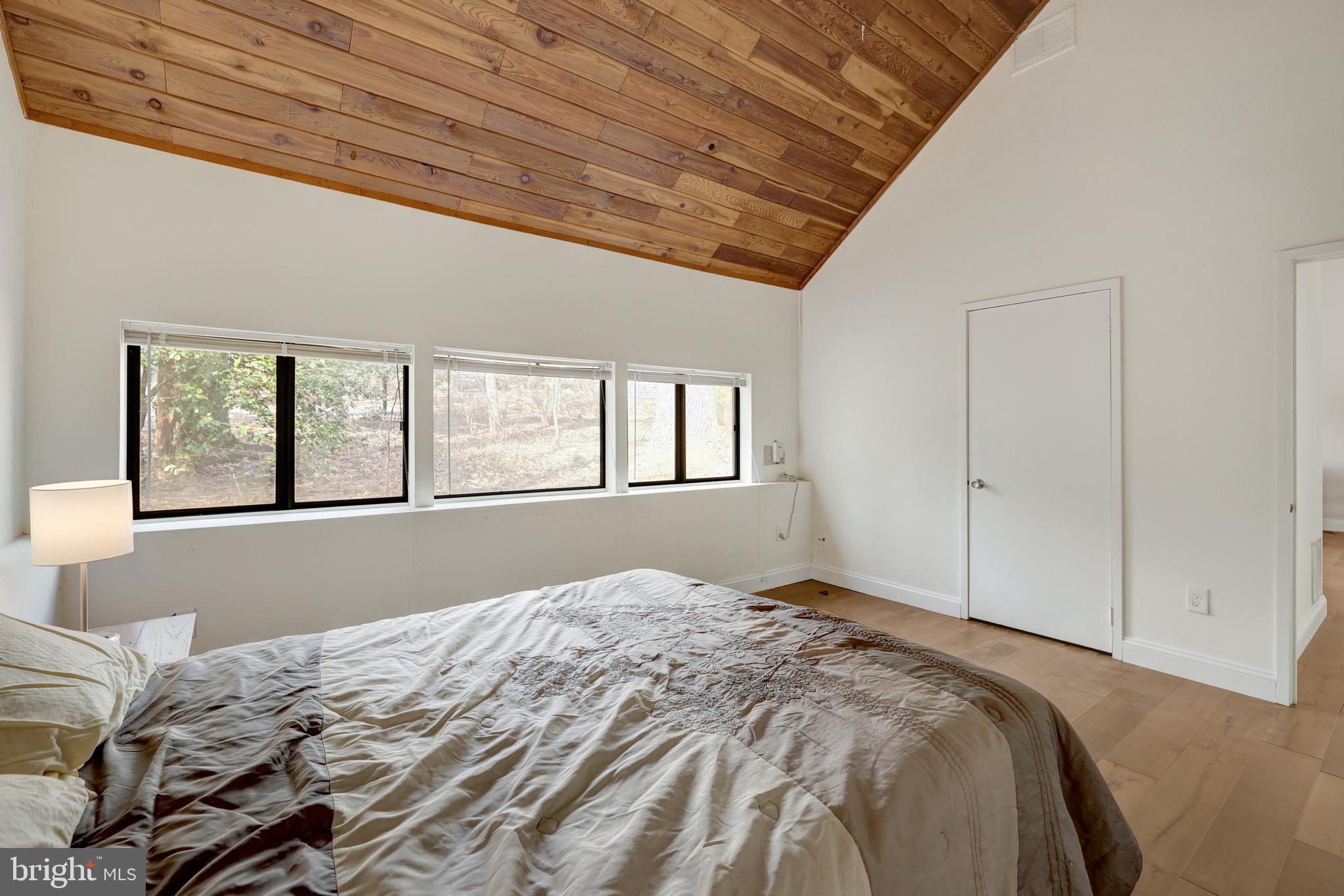 1941 Upper Lake Drive Reston, VA 20191 - Photo 27 of 51 a bed sitting in a bedroom next to a window