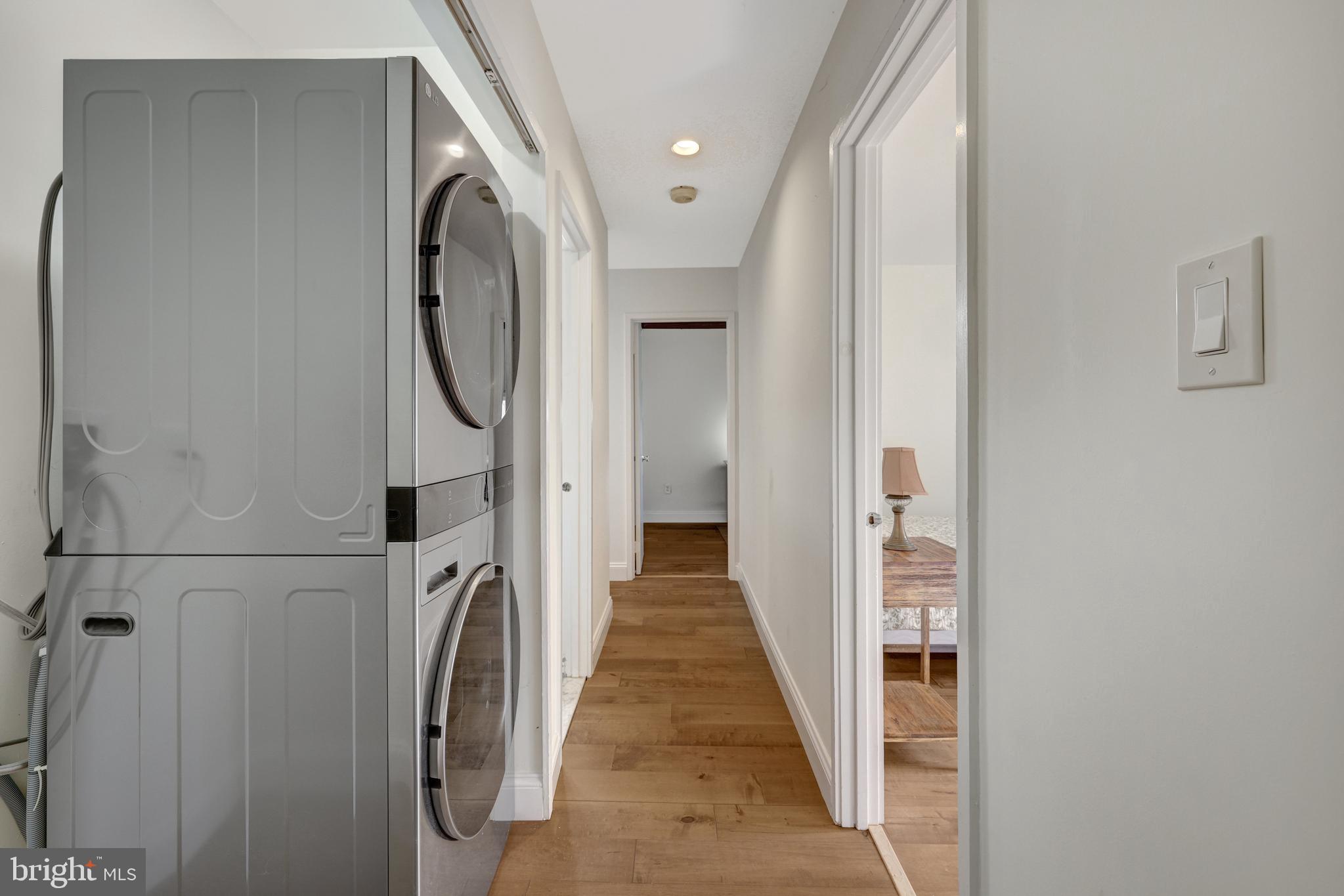 1941 Upper Lake Drive Reston, VA 20191 - Photo 28 of 51 a view of a hallway with wooden floor and staircase