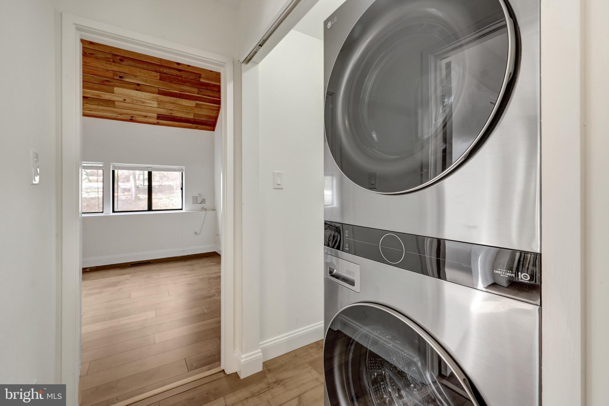 1941 Upper Lake Drive Reston, VA 20191 - Photo 29 of 51 a view of a hallway with washer and dryer