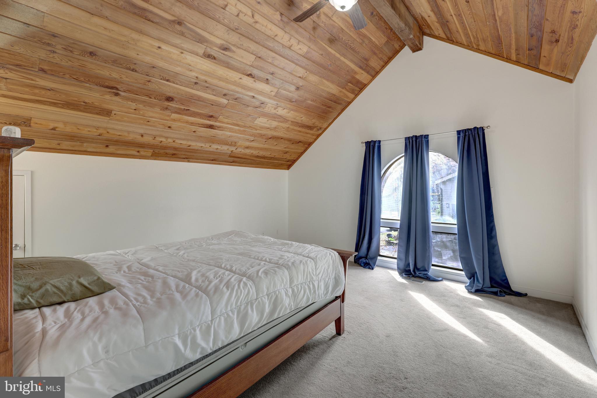1941 Upper Lake Drive Reston, VA 20191 - Photo 39 of 51 a bed sitting in a spacious bedroom next to a window