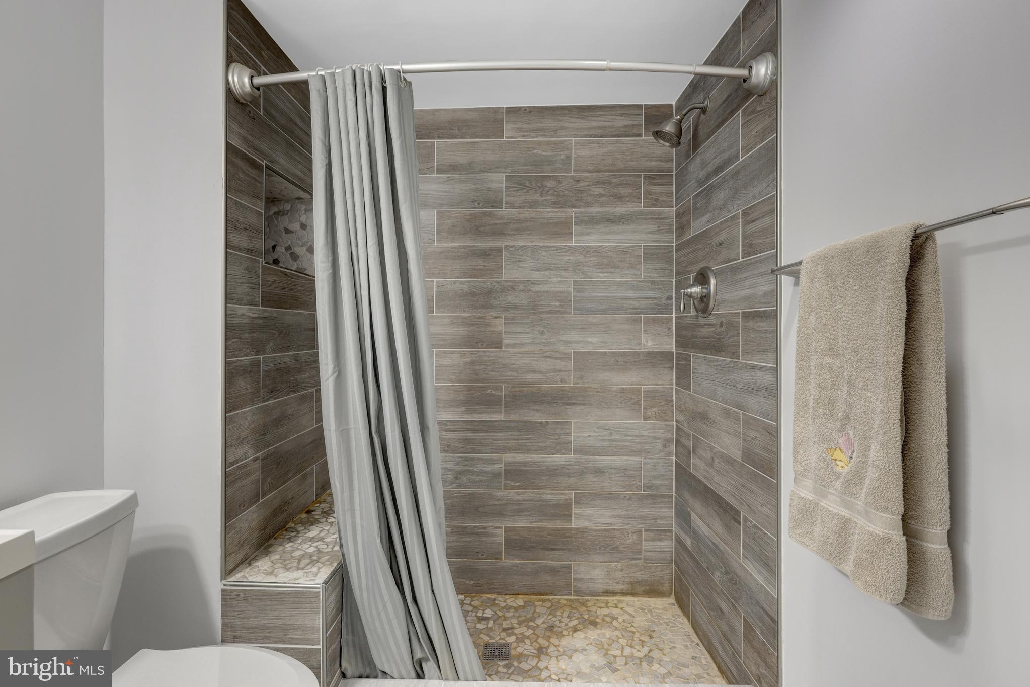 1941 Upper Lake Drive Reston, VA 20191 - Photo 42 of 51 a bathroom with a shower and a toilet