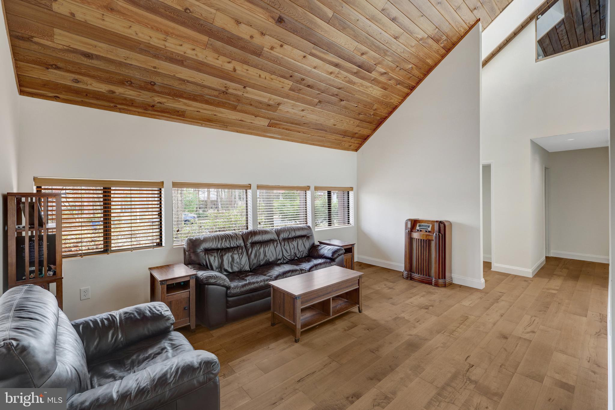 1941 Upper Lake Drive Reston, VA 20191 - Photo 7 of 51 a living room with furniture a ceiling fan and a window