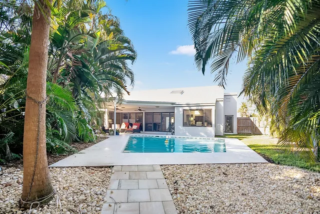 a living room with furniture and a work place