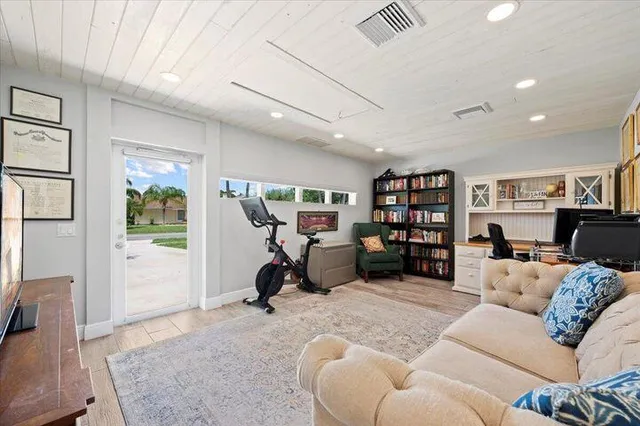 a bedroom with a bed and a tv