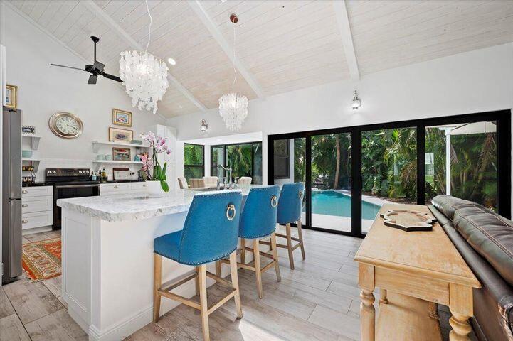 709 Irwin Lane Jupiter, FL 33458 - Photo 27 of 37 KITCHEN BLUE CHAIRS