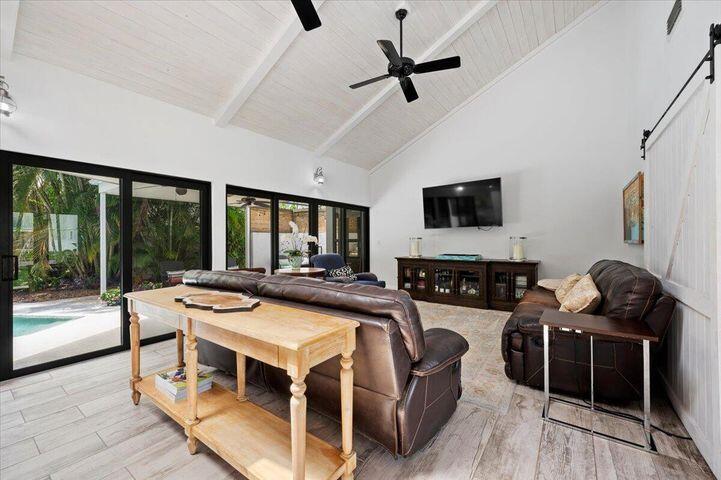 709 Irwin Lane Jupiter, FL 33458 - Photo 28 of 37 a view of a livingroom with furniture window and wooden floor
