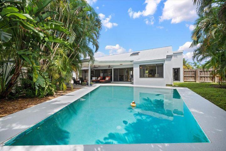 709 Irwin Lane Jupiter, FL 33458 - Photo 31 of 37 a view of a house with a yard