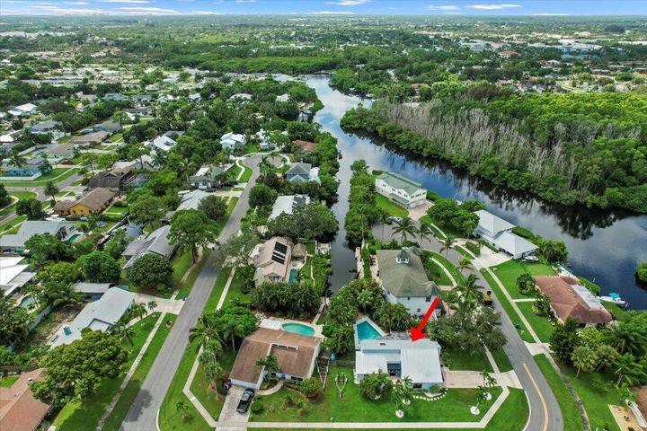709 Irwin Lane Jupiter, FL 33458 - Photo 4 of 37 an aerial view of residential houses with outdoor space and trees