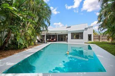 709 Irwin Lane Jupiter, FL 33458 - Photo 9 of 37 a view of a house with a yard