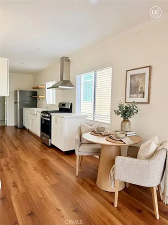a kitchen with a table and chairs in it