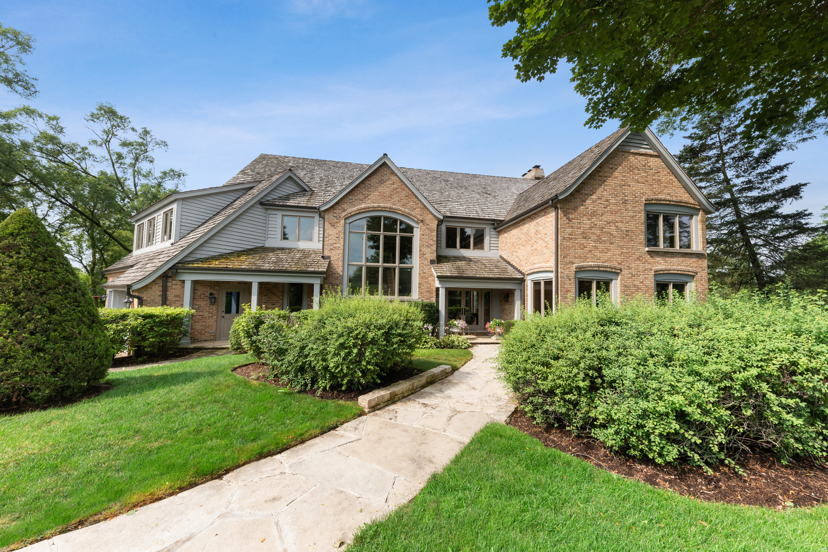 a front view of a house with a yard