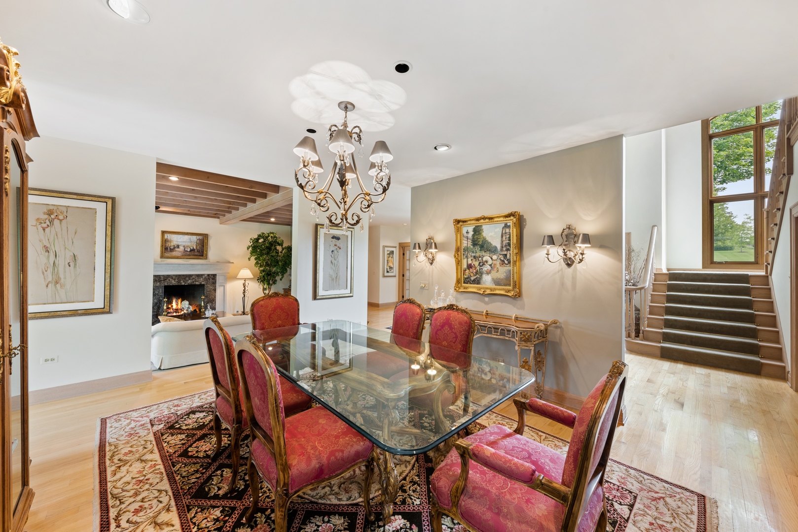 9 South Wynstone Drive North Barrington, IL 60010 - Photo 5 of 31 a dining room with wooden floor a chandelier a wooden table and chairs