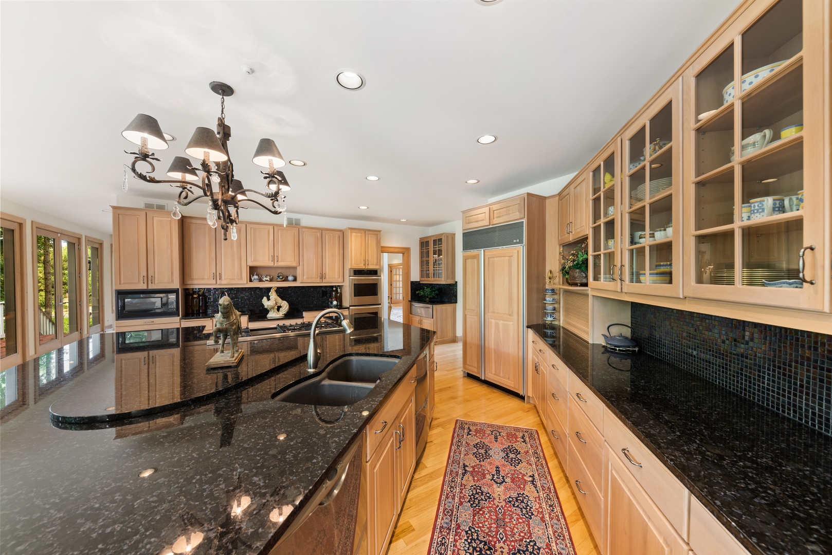 9 South Wynstone Drive North Barrington, IL 60010 - Photo 9 of 31 a kitchen with stainless steel appliances granite countertop sink stove top oven and cabinets