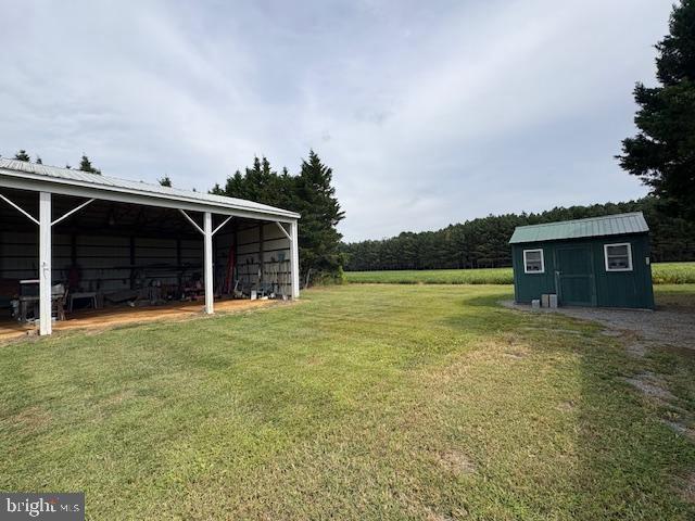 21682 Dover Bridge Road Preston, MD 21655 - Photo 3 of 23 a front view of a house with garden