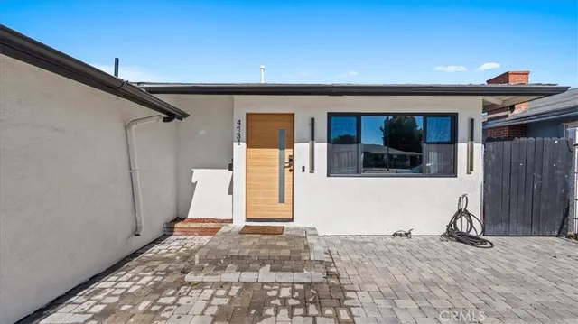 a view of a house with a wooden stairs