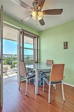 2475 West 16th Street, Unit 3D Brooklyn, NY 11214 - Photo 4 of 10 a view of a dining room with furniture window and wooden floor