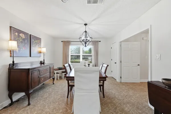 a living room with fireplace furniture and a fireplace