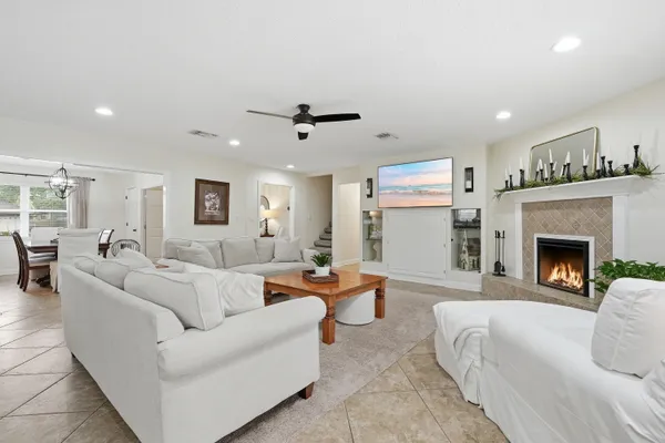 a kitchen with a sink cabinets and a window