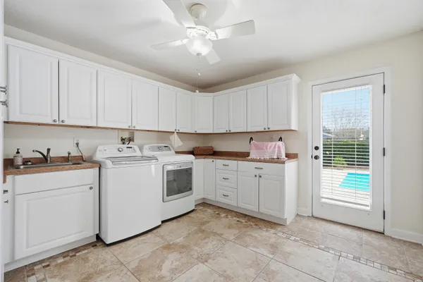 a bedroom with bed and a chandelier