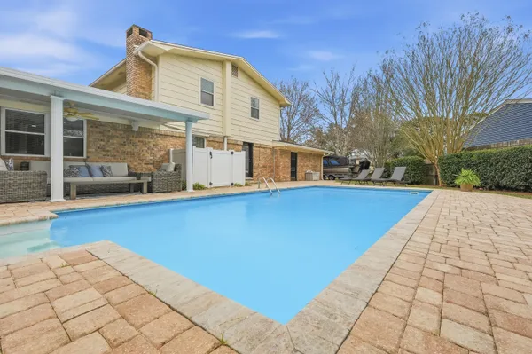 a view of a backyard with sitting area