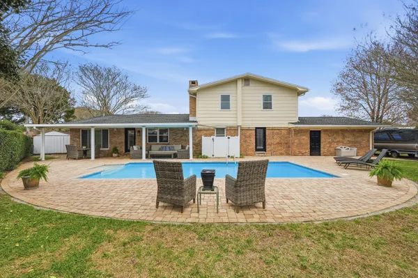 a front view of a building with a yard