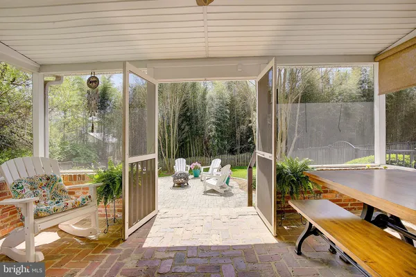 a view of entryway with furniture and wooden floor