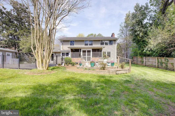 a large kitchen with stainless steel appliances granite countertop a stove and a sink